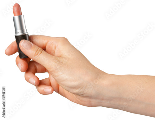 lipstick in hand isolated on white .