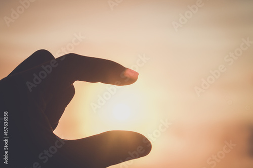silhouette hand with sunlight