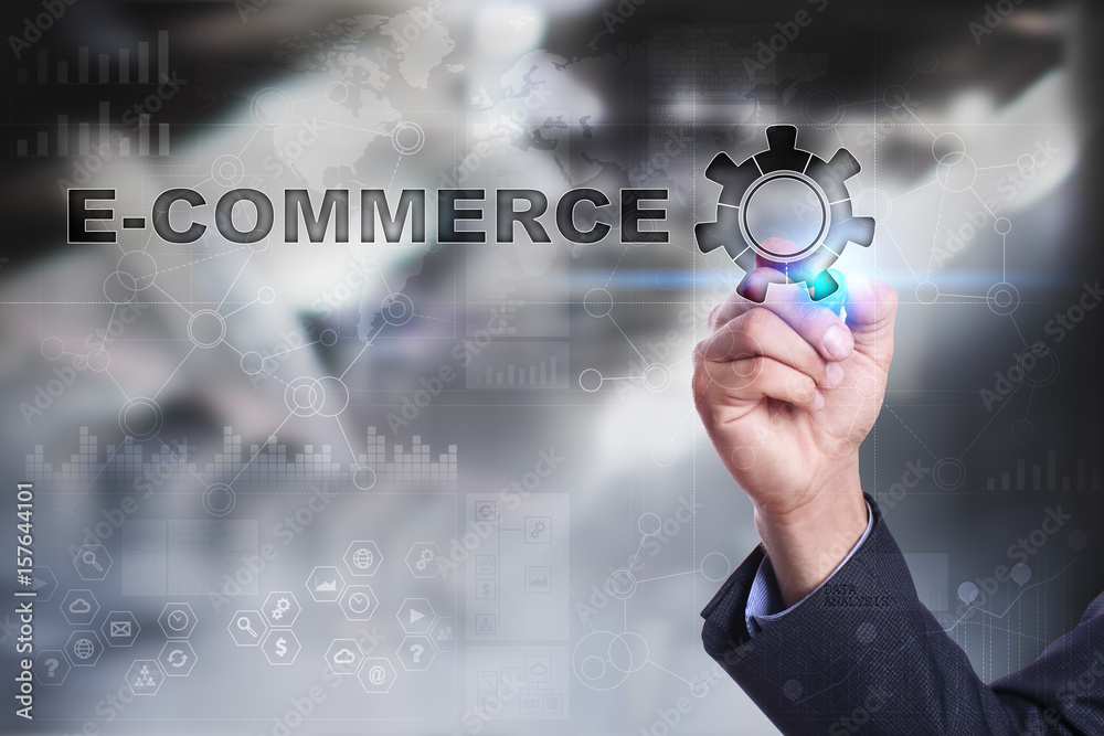 Businessman is drawing on virtual screen. e-commerce concept. Businessman is drawing on virtual screen. e-commerce concept.