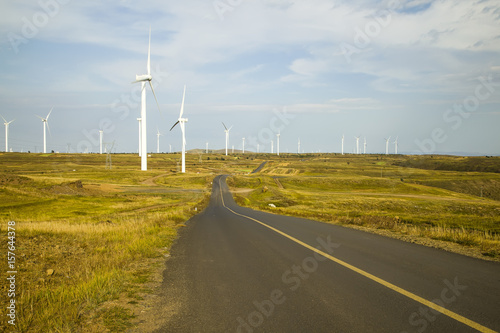 Asphalt road and wind turbines