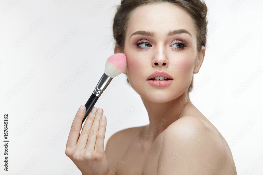 Facial Beauty Cosmetics. Sexy Woman Applying Blush With Brush