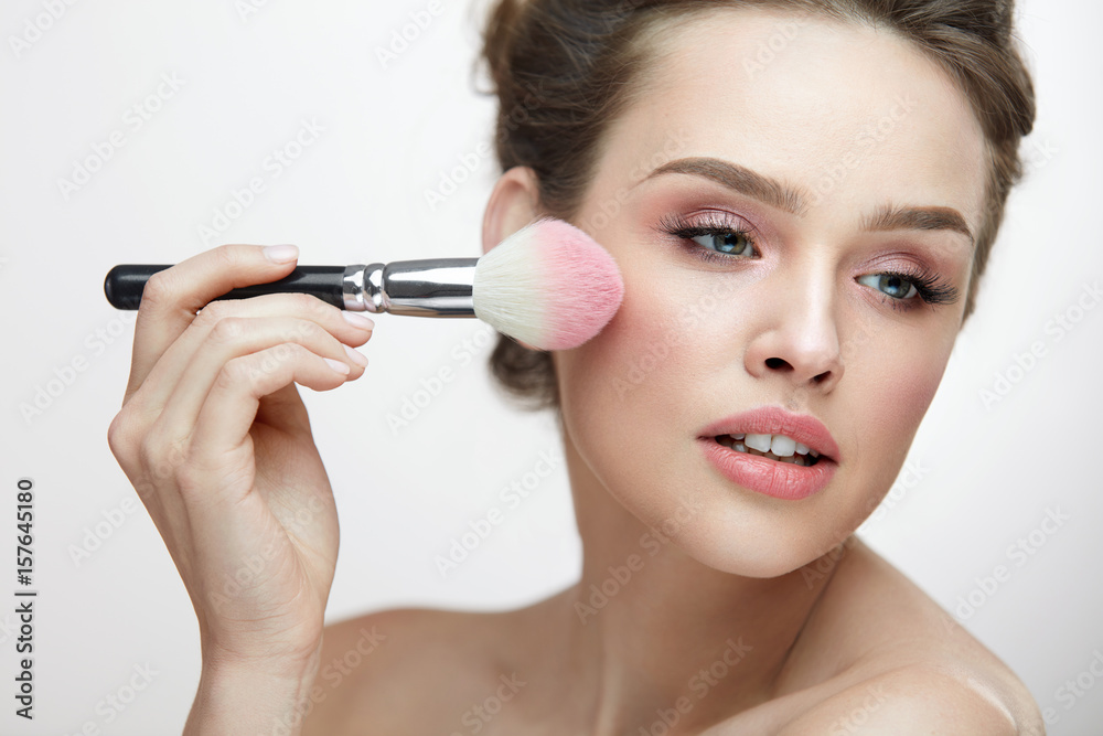 Facial Beauty Cosmetics. Sexy Woman Applying Blush With Brush Facial Beauty Cosmetics. Sexy Woman Applying Blush With Brush