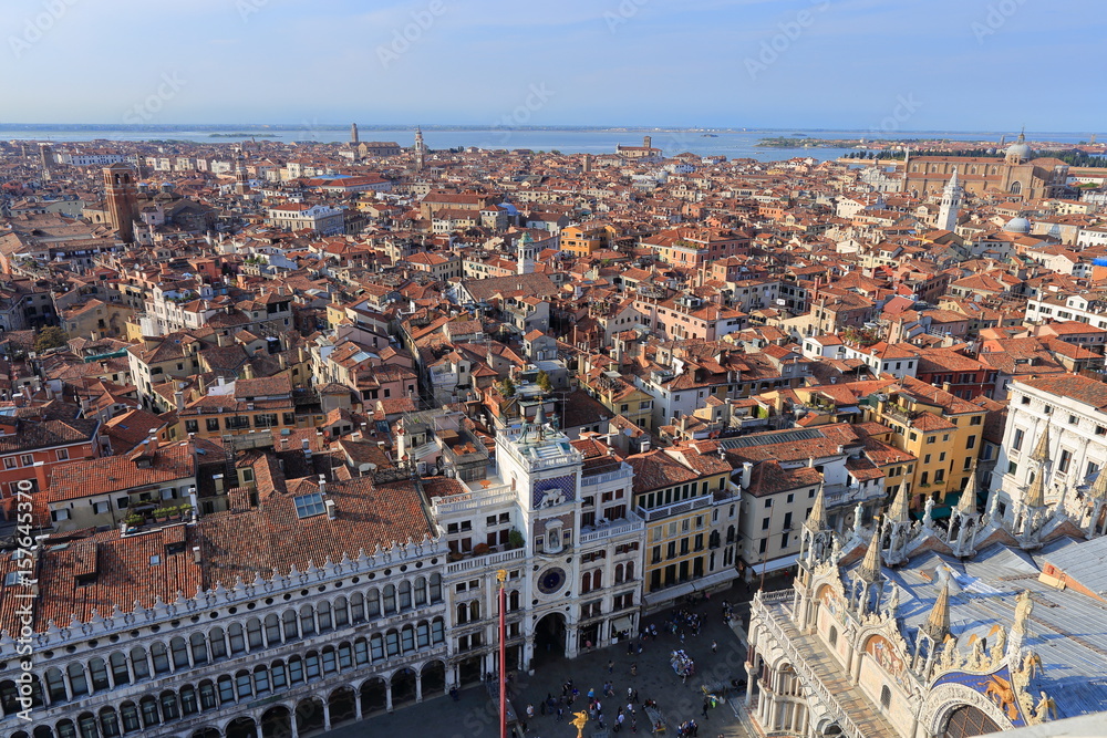 The view on San Marco Square with tourists near the Zodiac Clock Tower