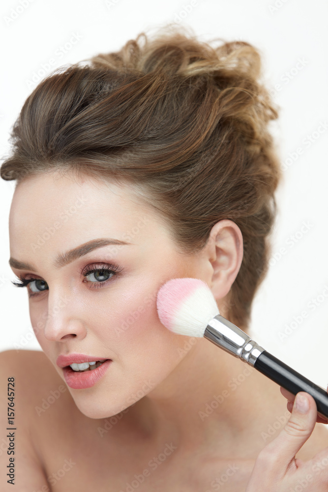 Woman Beauty Makeup. Female With Brush Putting Blush On Skin Woman Beauty Makeup. Female With Brush Putting Blush On Skin