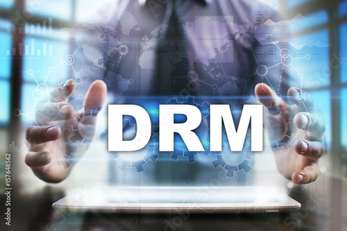 Businessman using tablet pc and selecting drm.