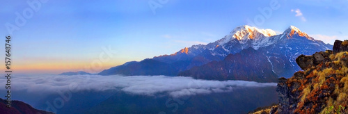 Mountain Landscape in Himalaya. Above clouds. Annapurna South peak.
