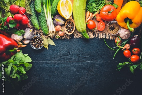Fototapeta Naklejka Na Ścianę i Meble -  Frame of organic food. Fresh raw vegetables and spices. On a wooden chalkboard.
