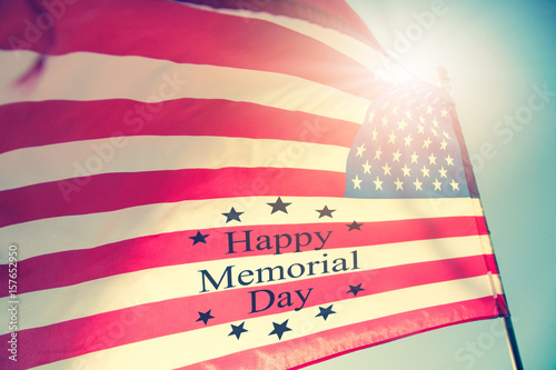 Happy Memorial Day Greeting, USA patriotic flag on blue sky and sunlight background with text Happy Memorial Day. photo