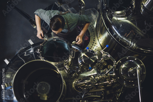 Brewer inspecting tank