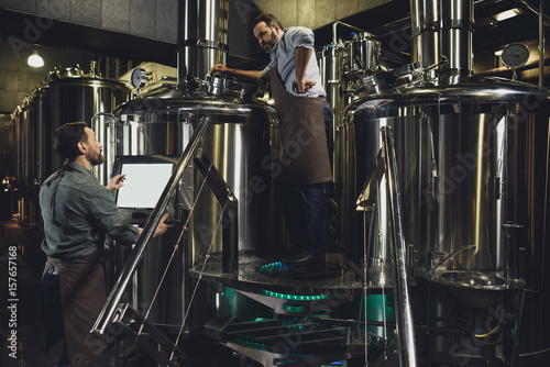 Brewers working with tanks © LIGHTFIELD STUDIOS