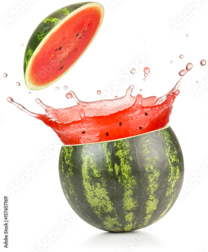 watermelon juice spilling out of a cut fruit 
