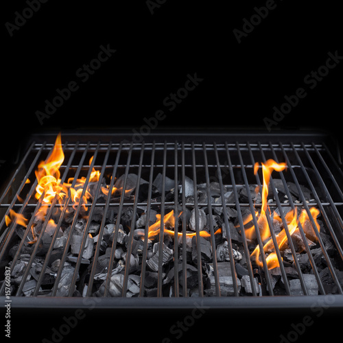 Grill, BBQ, fire, charcoal barbecue, closeup. Roaster grate for cooking.  Isolated on black background