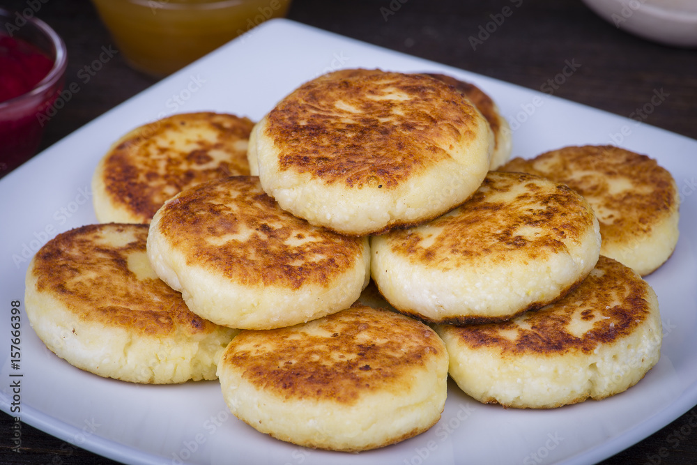 Delicious homemade cheese pancakes close-up Delicious homemade cheese pancakes close-up