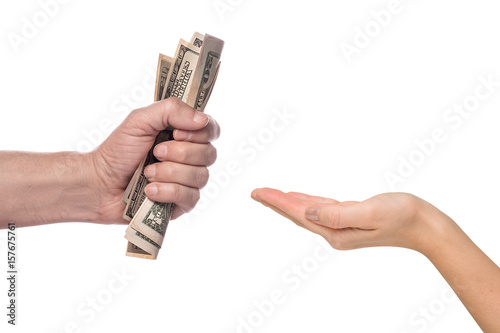 Male hand squeezing tightly some banknotes