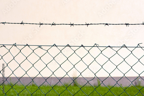 Barbed wire fence in front of the factory