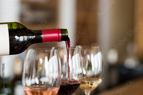 Fotografie, Obraz Pouring wine in glasses