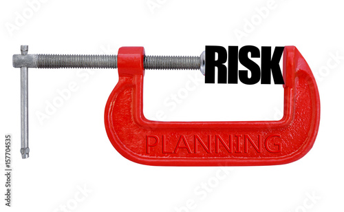 Tableau sur toile Risk clenched in a red clamp