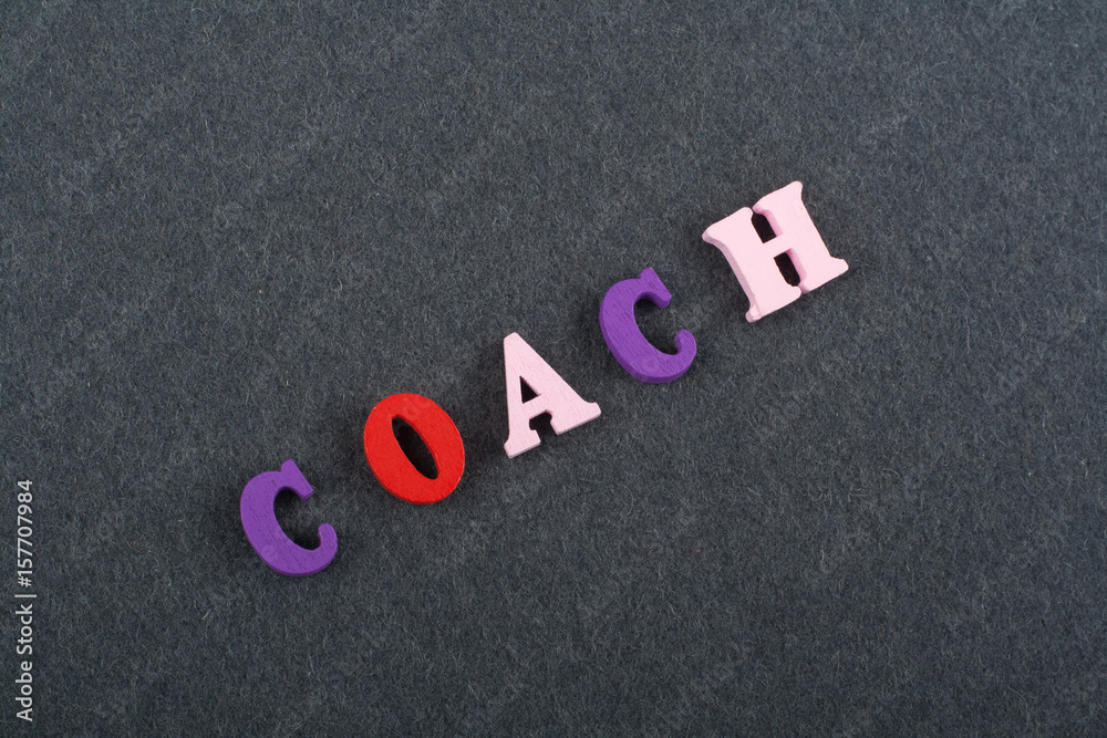 COACH word on black board background composed from colorful abc alphabet block wooden letters, copy space for ad text. Learning english concept. COACH word on black board background composed from colorful abc alphabet block wooden letters, copy space for ad text. Learning english concept.