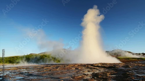 Wallpaper Mural Eruption of geyser in Iceland. Winter cold colors, sun lighting through the steam Torontodigital.ca