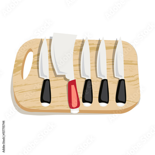 Set of kitchen knives on a board  top view