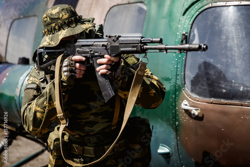 Photo of a soldier with an automatic rifle
