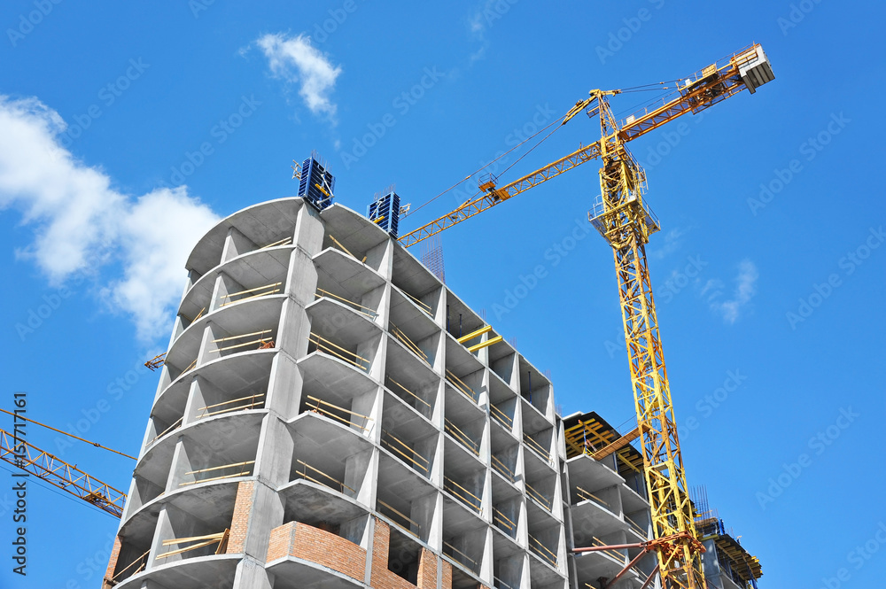 Crane and highrise construction site