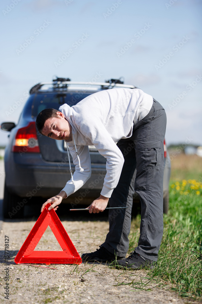 Man next to broken car Man next to broken car