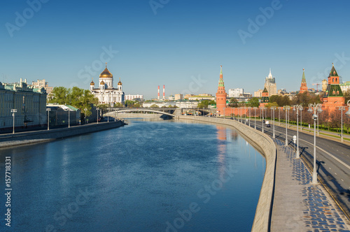 Morning view of Bolshoy Kamenny Bridge over Moskva River, embankments, Kremlin Towers, Cathedral of Christ the Saviour in Moscow, Russia.