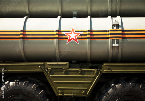 Russian army background: rocket launcher decorated with St. George ribbon and a star symbol. Missile system vehicle close-up backdrop