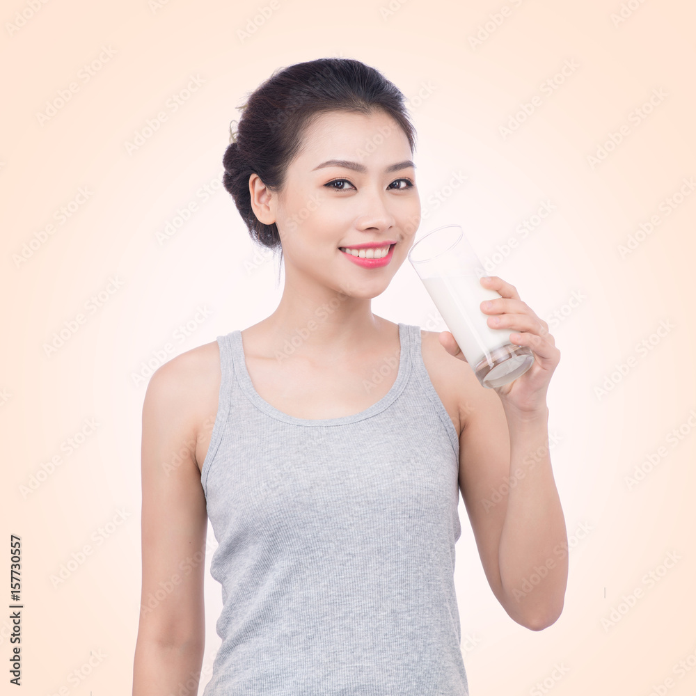 Healthy nutrition. Happy young asian woman drinking milk Healthy nutrition. Happy young asian woman drinking milk
