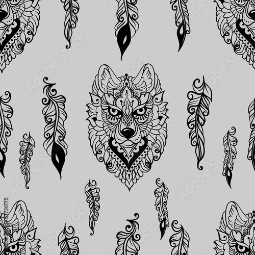 Seamless pattern with wolf and feathers