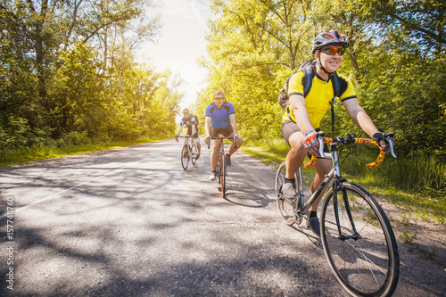 bikers on a summer workout on a forest road