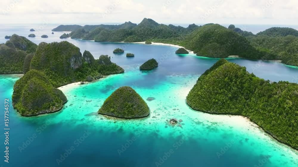 Tropical aerial view. Drone 4k paradise video. Tranquil island over blue ocean. Tropical background panorama. Natural tropical atoll beach. Paradise island view