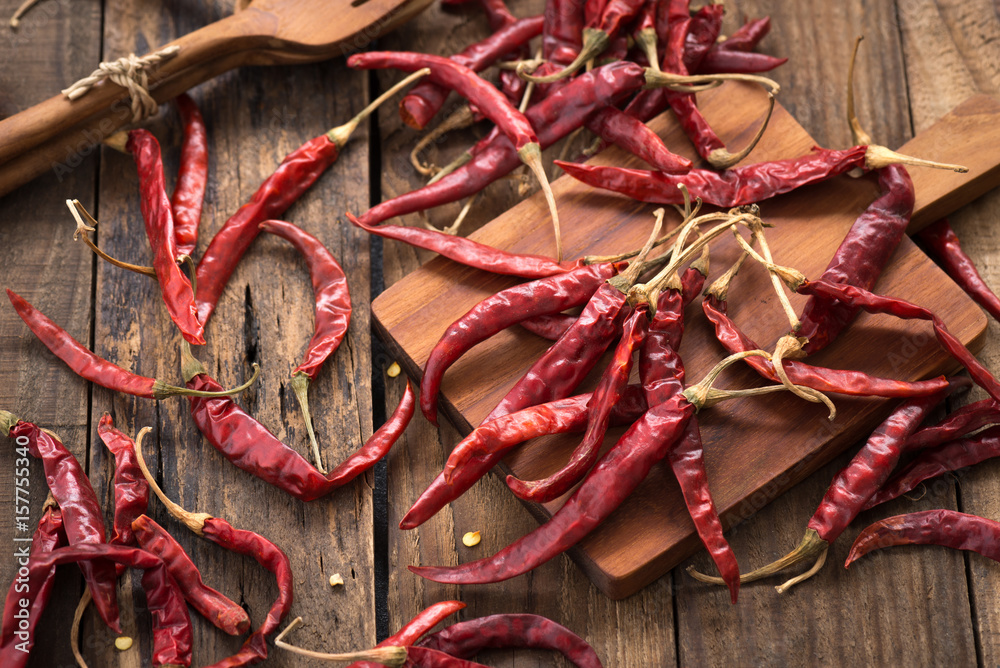 Red Dried Chillies or Dry chillies on wood


