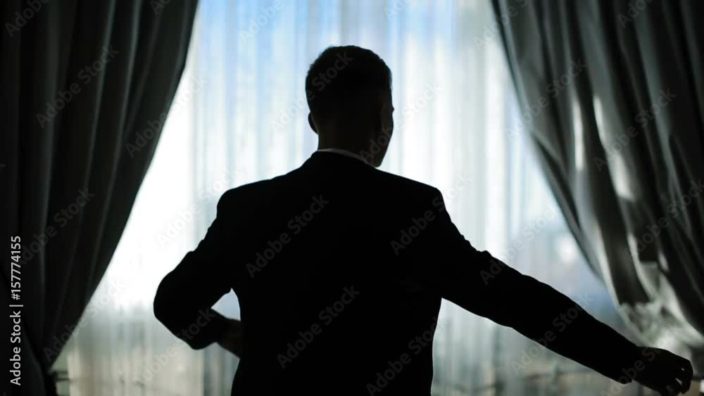 Man Wears A Jacket. Concept Of Business Dress Man Wears A Jacket. Concept Of Business Dress