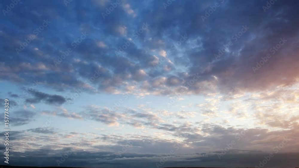 Beautiful cloudscape with large, building clouds and sunrise breaking through cloud mass. Beautiful cloudscape with large, building clouds and sunrise breaking through cloud mass.