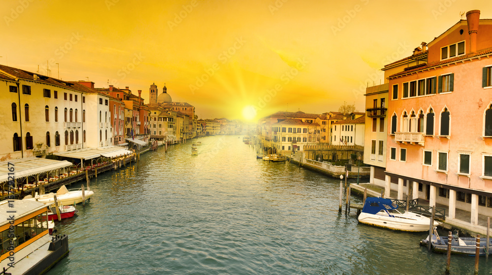 Sunset view of Grand Canal with gondolas in Venice, Italy.