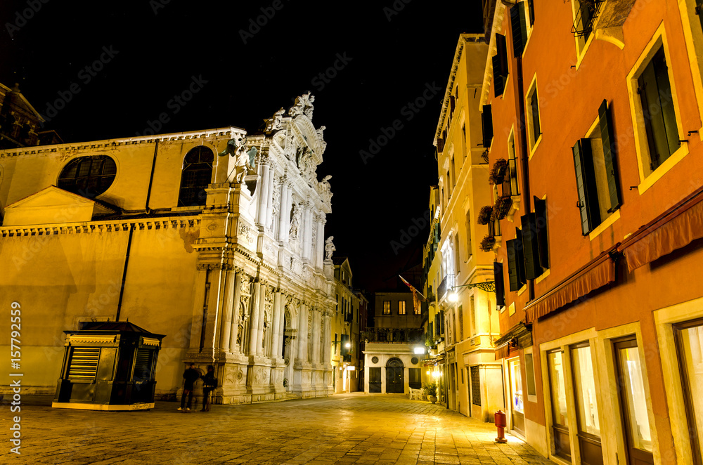 Night scene of street with Church Santa Maria del Giglio facade in Venice, Italy