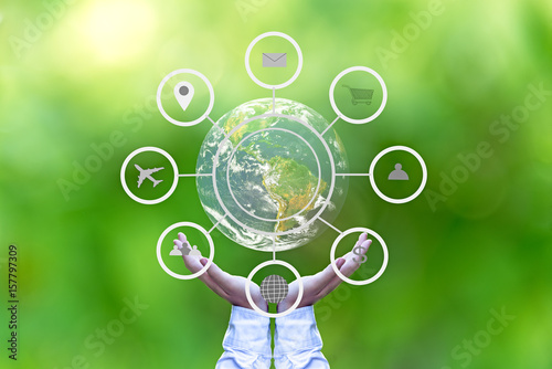 Hand holding globe with abstract global business cycle sketch on green background. Elements of this image furnished by NASA