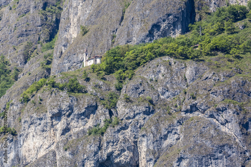 Little church on the rocks over Lake Como, Lombardy, Italy.