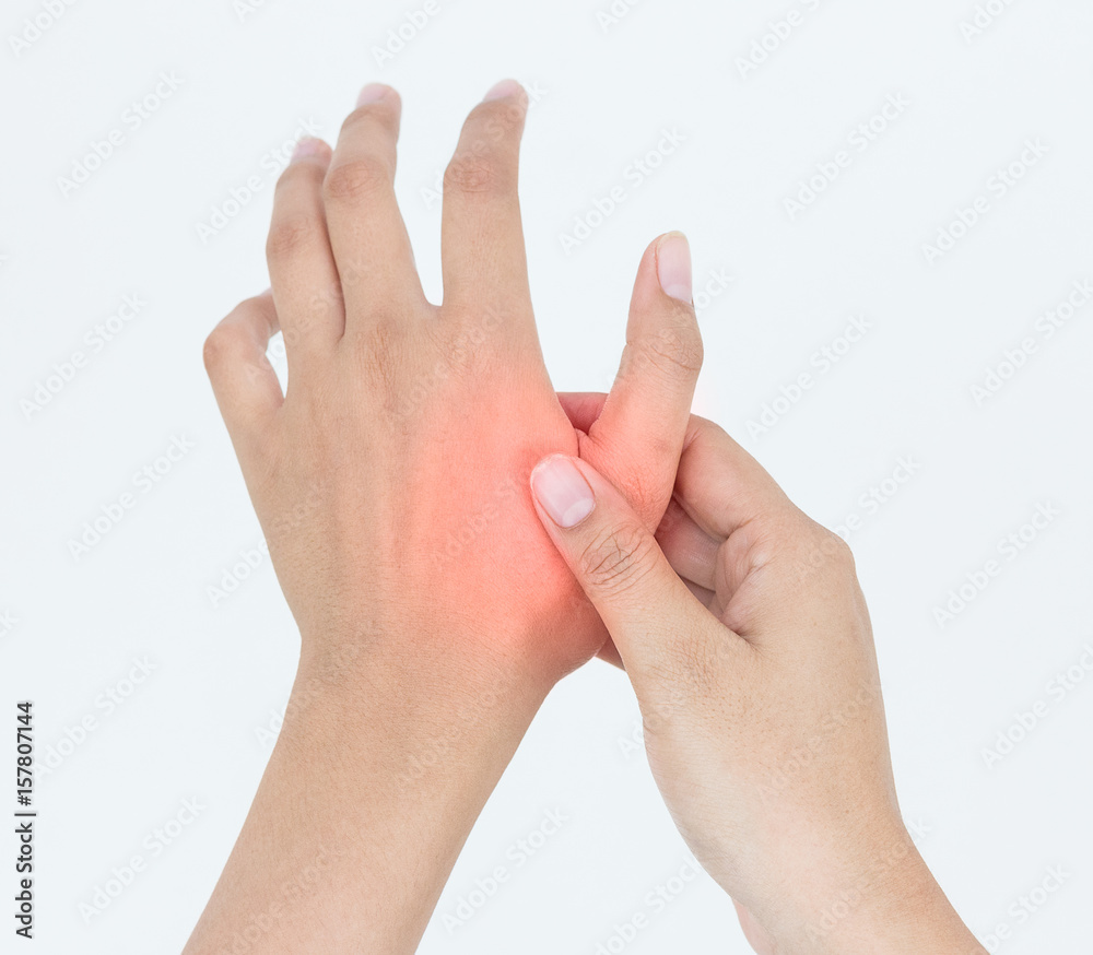 Young woman massaging her painful hand, suffering from hand pain isolated on a white background Young woman massaging her painful hand, suffering from hand pain isolated on a white background