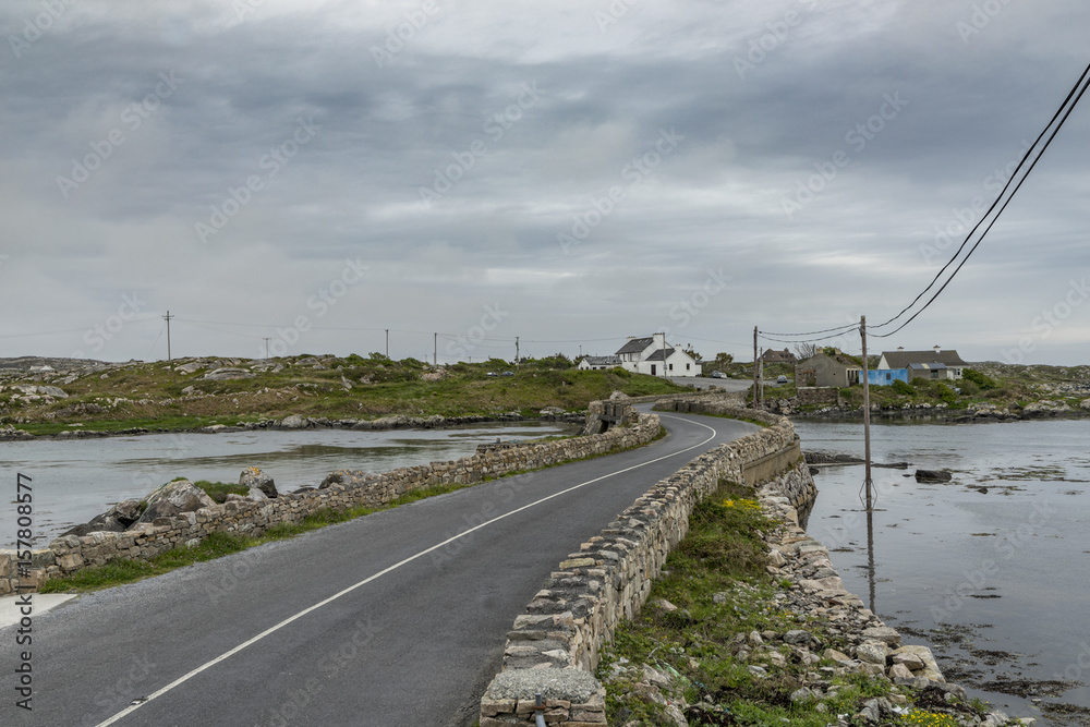 Irish road and cottage near Golam Head, Co. Galway, Ireland, Europe.