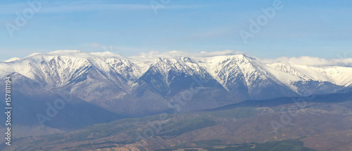 Panorama of snowy mountain peaks range