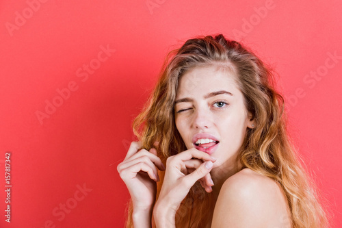 winking woman with long beautiful hair and no makeup