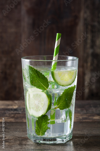 Mojito cocktail in glass on wooden table
