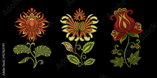 Fototapeta Naklejka Na Ścianę i Meble -  Embroidery design. Collection of floral elements for fabric and textile prints, patches or stickers. Beautiful ethnic flowers ornament in traditional Ukrainian decorative painting style of Petrykivka.