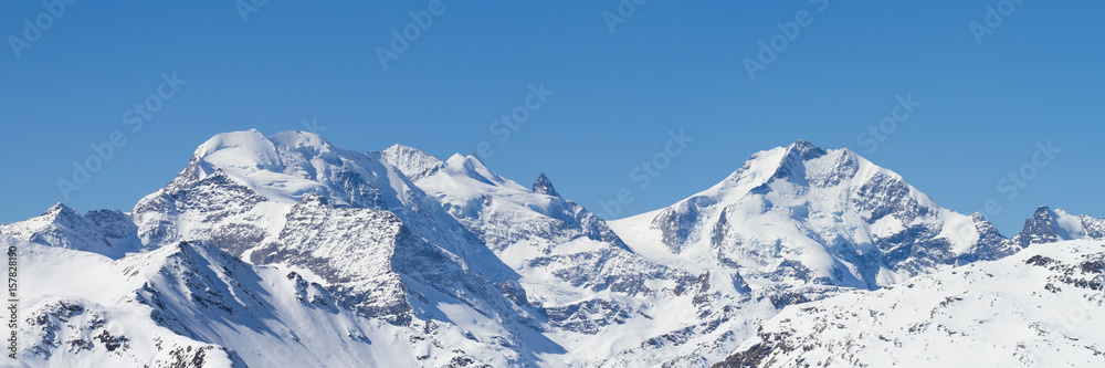 Panoramic winter view from Livigno of Bernina grouppe