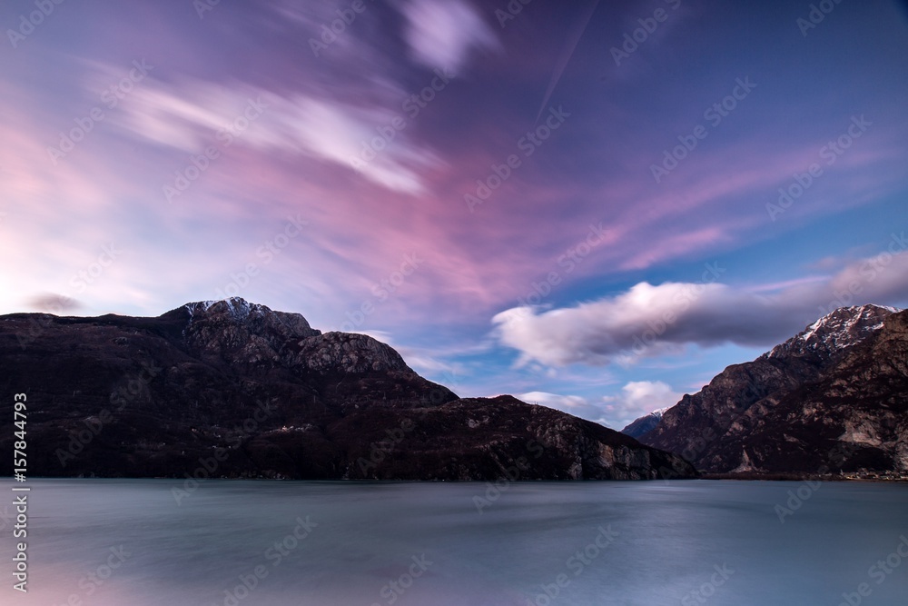 Clouds moved by the wind at sunset by the lake of Novate Mezzola, Valchiavenna,Lombardy Italy Europe