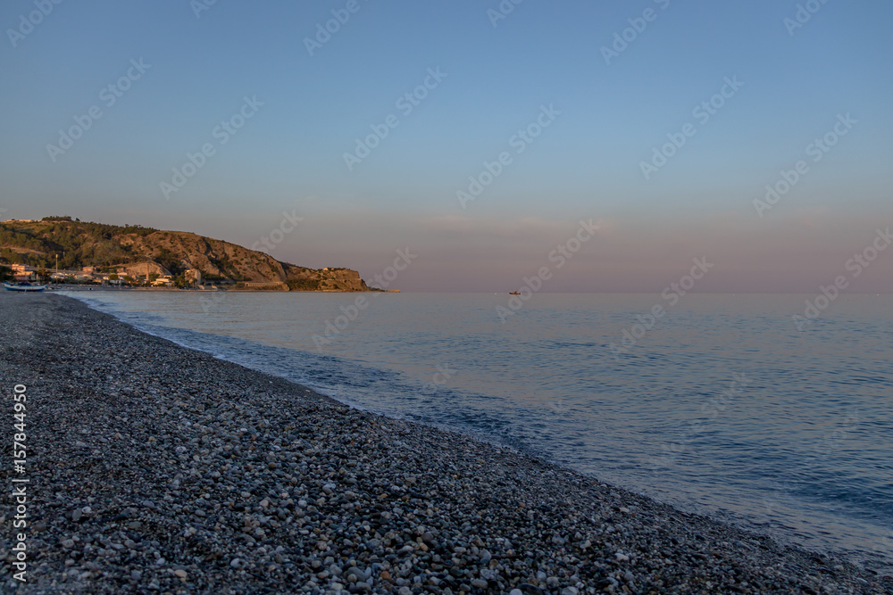 Sunset on a Mediterranean beach of Ionian Sea - Bova Marina, Calabria, Italy