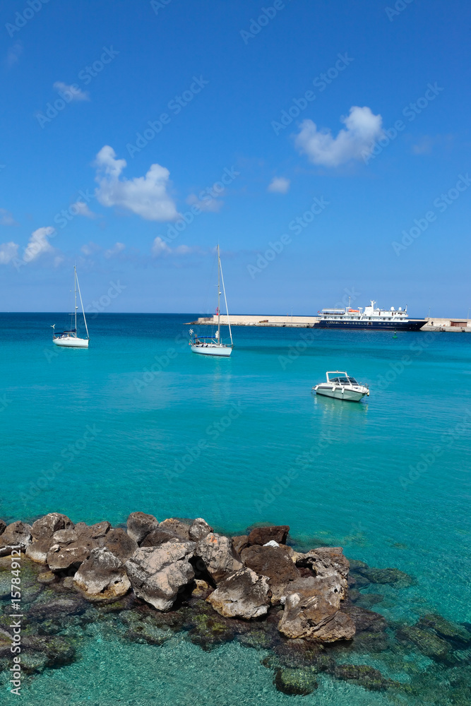 Clear blue waters of Otranto with yachts, Salento, Apulia, Italy